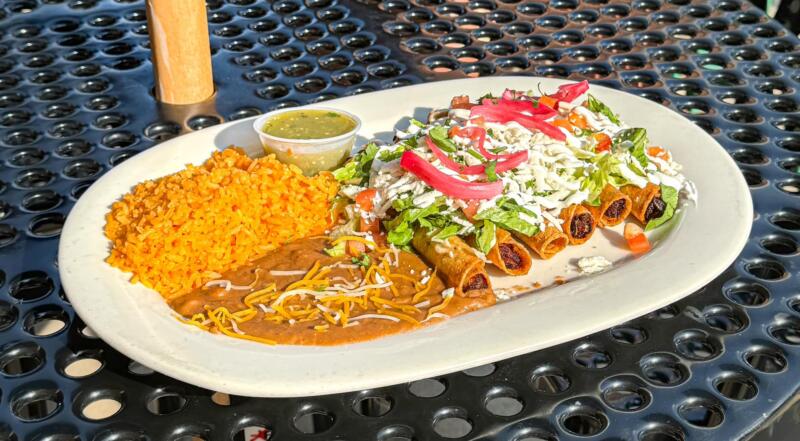 Fiesta Las Margaritas Rice, beans and flautas plated