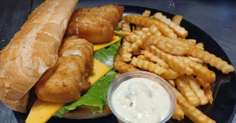 Fish sandwich and fries from Uptown Bar in Watertown