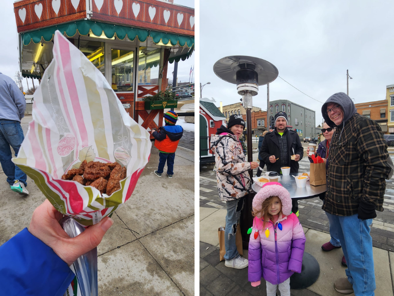 Hand holding package of roasted nuts and a group eating at a high top table outdoors. 