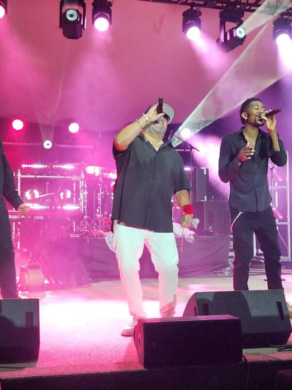 Color Me Badd on stage with roses in their hands