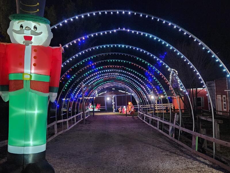 Blow up nutcracker and an arch of Christmas lights at Glacier Rock Farms