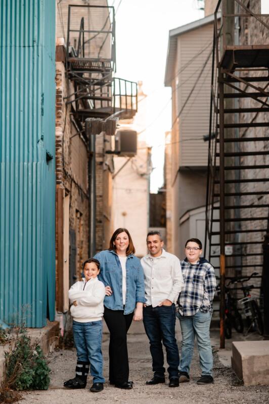 Family getting photos taken in a Watertown Wi alleyway