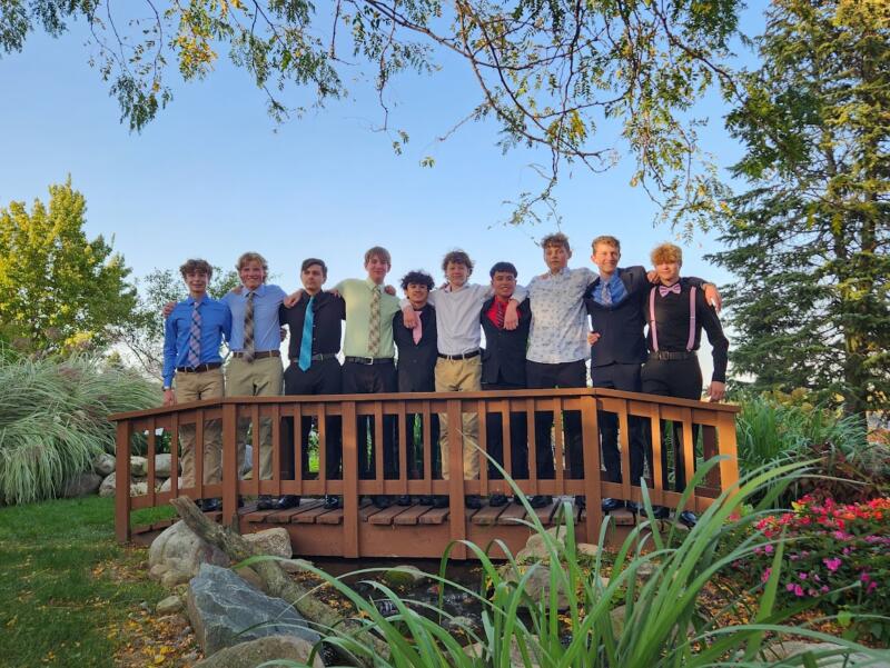 Boys on a bridge posing at Ebert's Greenhouse Village