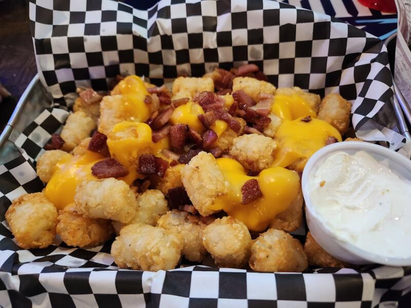 Loaded tots in a basket at Wolfgram Sports Bar & Grill in Watertown Wi