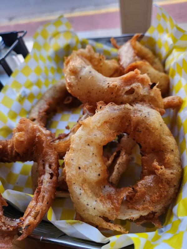 Onion rings in a basket at Wolfgram Sports Bar & Grill in Watertown Wi