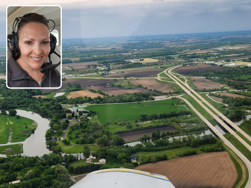 Aerial view of Watertown with a smaller box photo of a woman with headset on