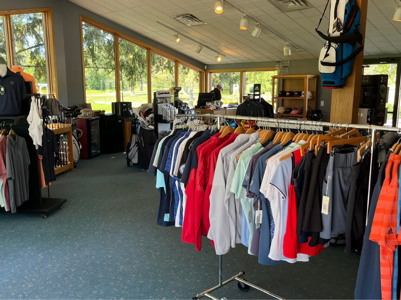 racks of golf clothes and accessories at the Pro Shop at Watertown Country Club
