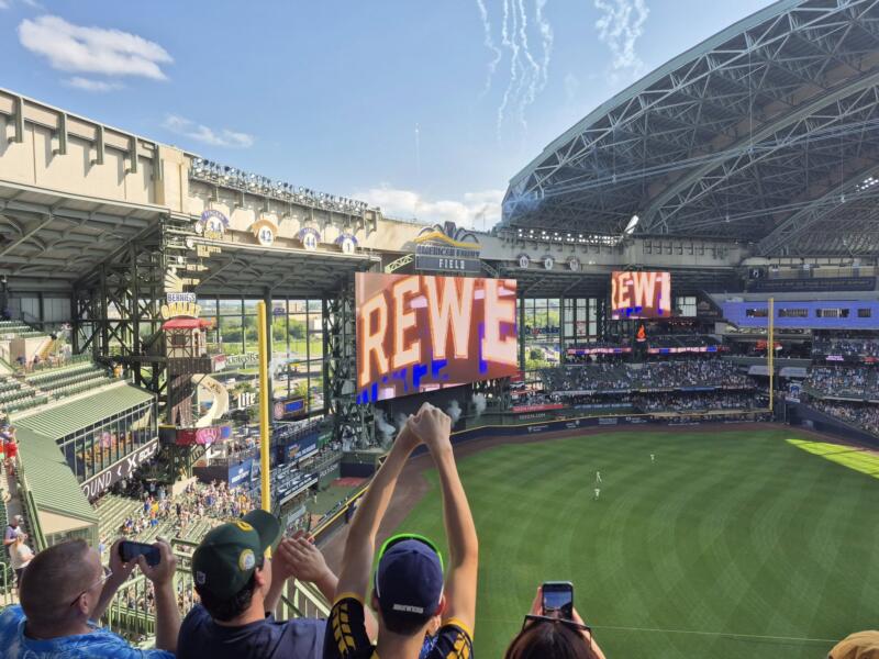 Cheering fans in the stands at AmFam Field, home of the Milwaukee Brewers