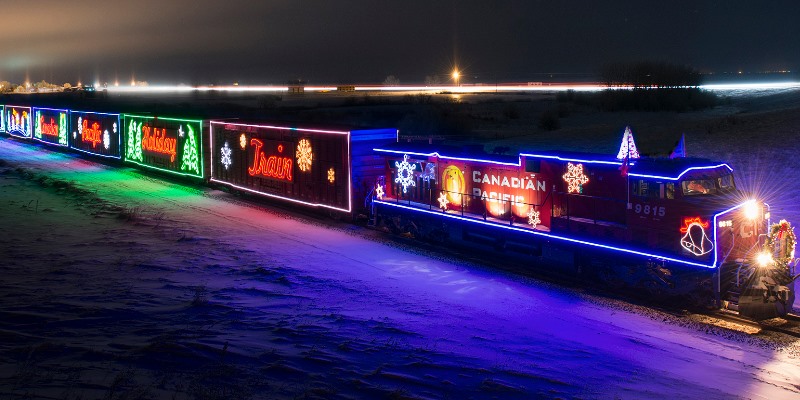 CPKC Holiday train all lit up after dark. 