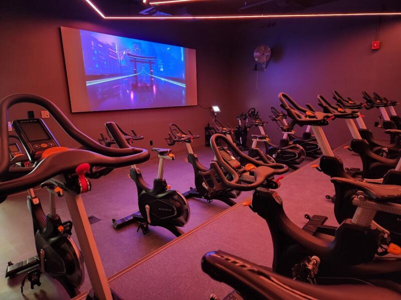 Bikes in a spin room facing a large screen TV at the YMCA in Watertown wi