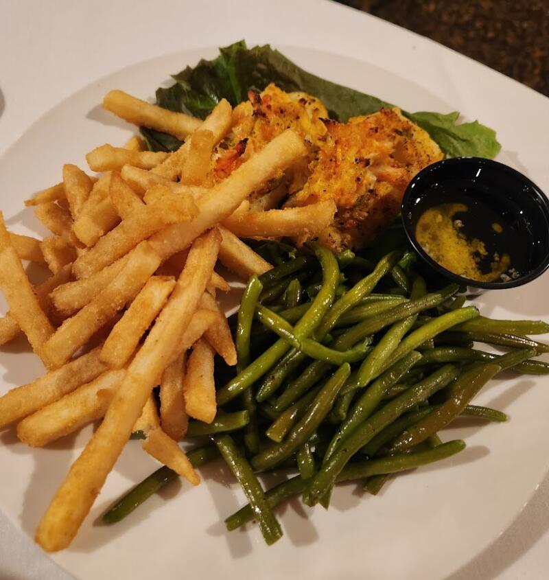 Fish, french fries, and green beans on a plate