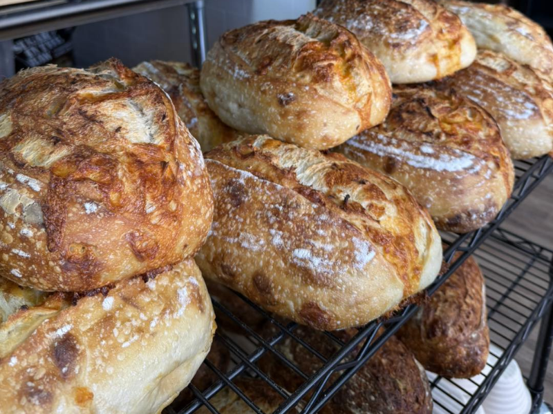 loaves of sourdough bread on a shelf