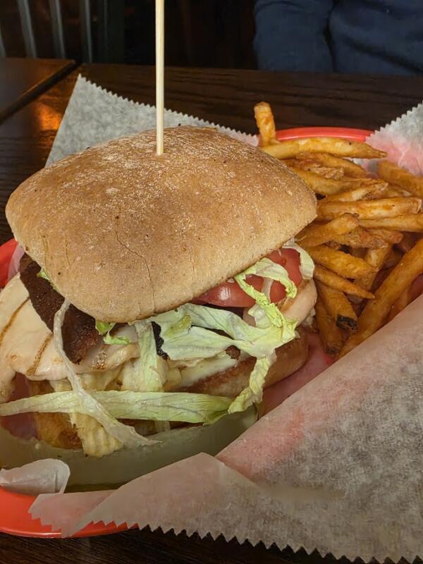 chicken sandwich and fries in a basket